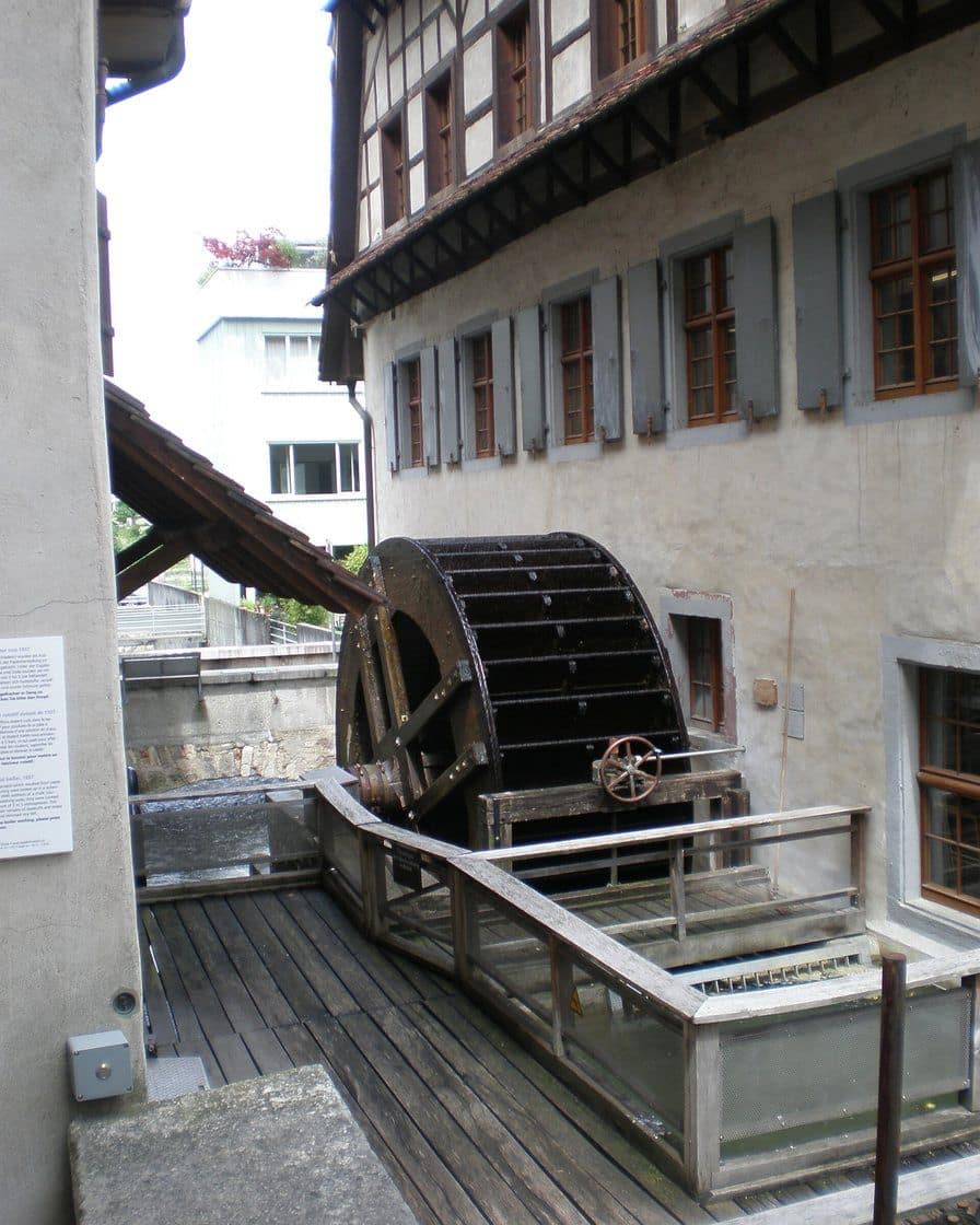 The Basel Paper Mill in the St. Alban-Tal, an old half-timbered house with a wooden water wheel on the canal