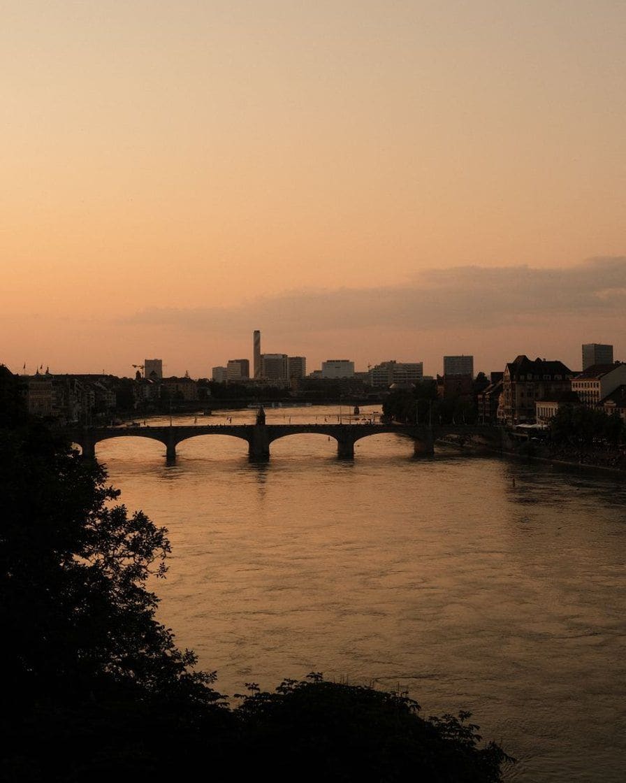 The Rhine in Basel at sunset, a bridge against the light
